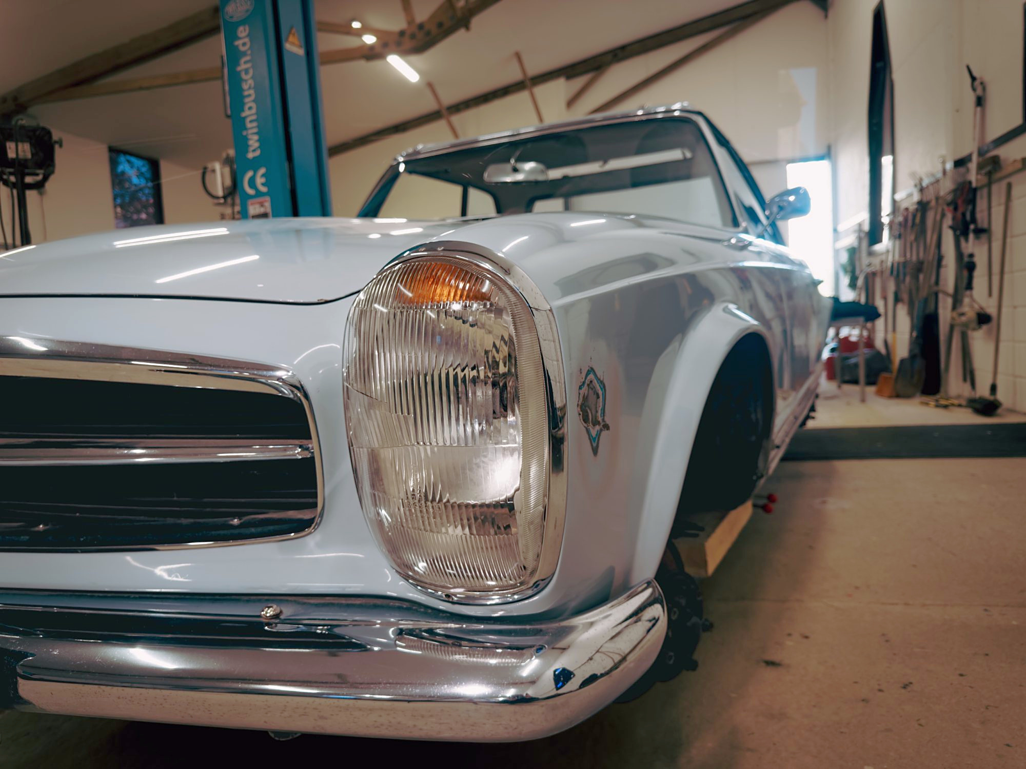 Close view of the Pagoda’s headlamp, grille and chrome bumper